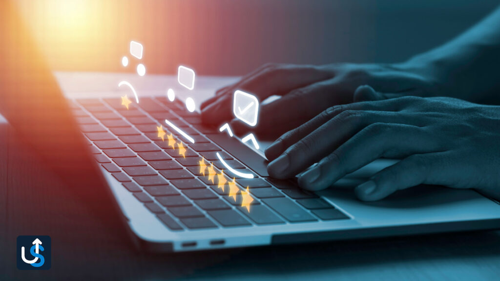 An image of a person typing on a laptop.