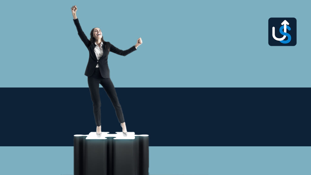 A business woman standing on top of a box.