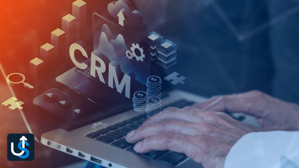 A person typing on a laptop with the word crm on it.