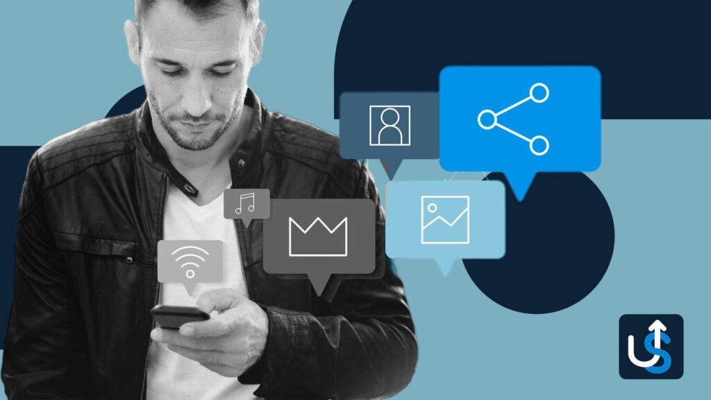 A person in a black jacket uses a smartphone while icons for music, photos, and sharing appear above in speech bubbles.