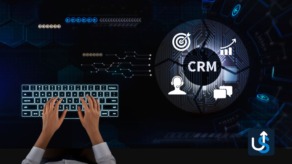 Hands typing on a keyboard with CRM-related icons and graphs on a digital interface in the background, representing customer relationship management technology.