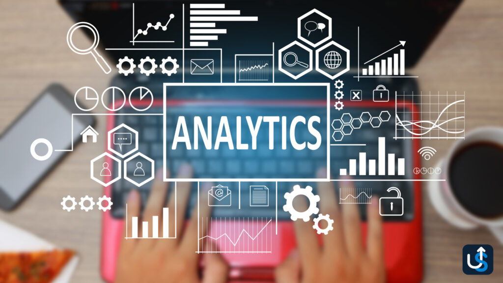 Hands typing on a red laptop keyboard with digital analytics icons overlay, including graphs, accounting firm reports, gears, and magnifying glasses.