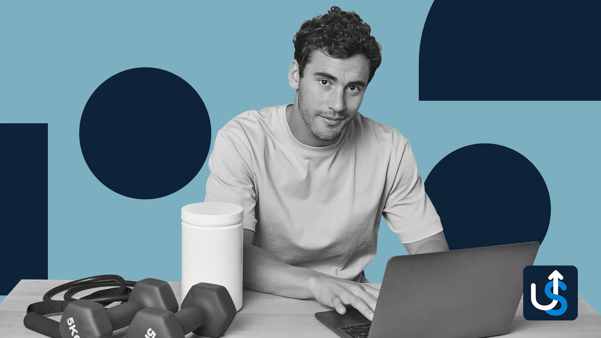 Man sitting at a table with a laptop, weights, and a protein container, set against a blue geometric background.