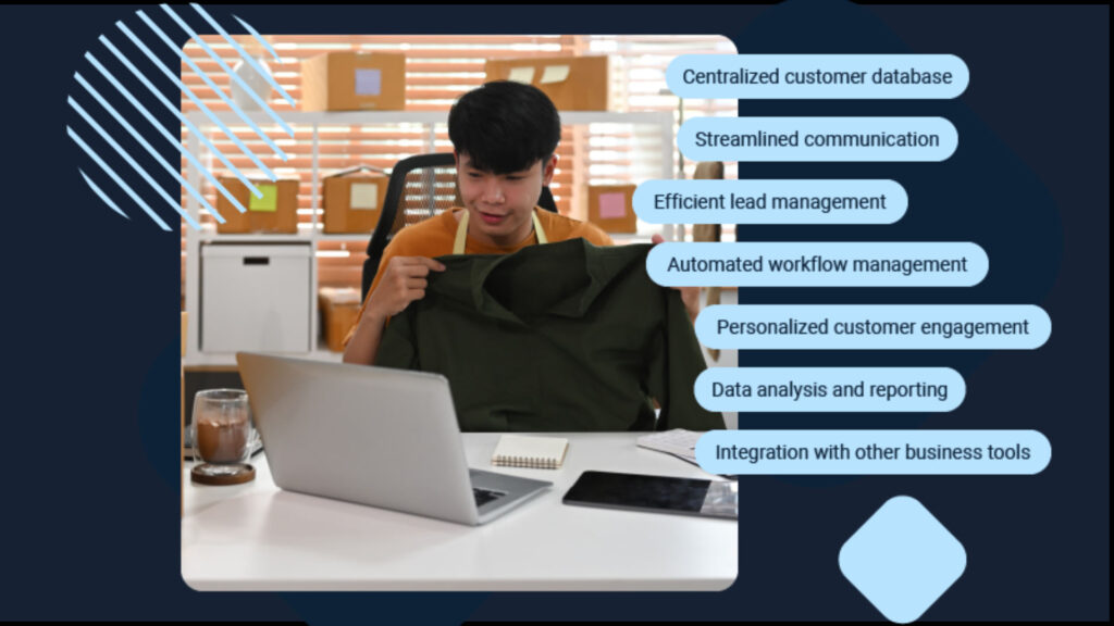 Man sitting at desk holding a shirt while looking at a laptop, with a list of business management software features displayed on the right side.